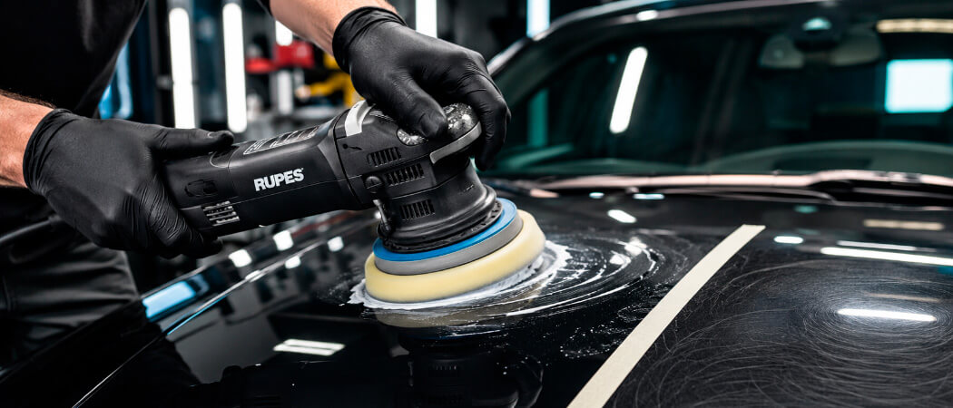 machine polishing a car to remove light surface scratches